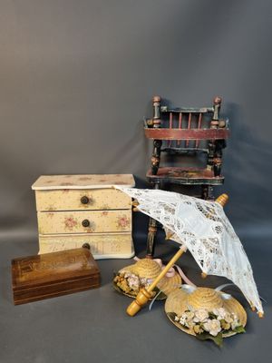 a small collection of antique items on a gray background