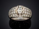 a close up of a diamond ring on a black surface