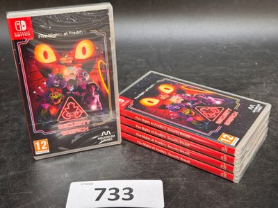 trois jeux vidéo posés côte à côte sur la table