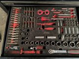 many tools in a tool box on the table