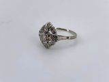 a close up of a silver ring with a stone in the middle