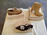 two pairs of shoes that are sitting on a table