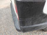 a close up of a car with a black bumper