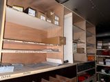 many boxes and boxes on the shelves in the room