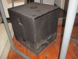 a speaker that is sitting on the floor in a room