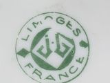 a close up of a plate with a green logo on it