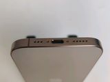 the back view of a silver iphone with a camera attached to it