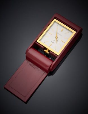 an image of a red watch with a gold face