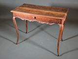 a small wooden table with a drawer on top of it