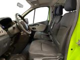 the interior of a green van with a steering wheel and dashboard