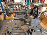 a sewing machine that is sitting in a room