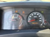 a close up of a car dashboard with a speedometer and gauges