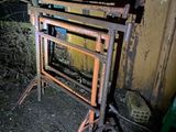 a metal frame that is sitting in the dirt