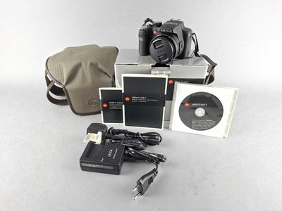 a camera and other items that are sitting on a table