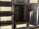 a cabinet that has many drawers on it
