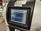 a machine that has a screen on it in a store