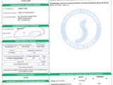 a green and white document with a barcode on it
