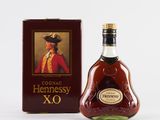 the bottle of hennessy xo is next to the box