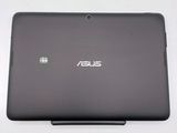 a close up of a laptop on a white surface