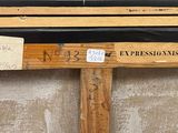 a piece of wood that has some writing on it