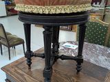 a stool with a cushion on top of it in a store