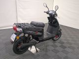 a scooter that is parked in a garage