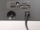 a close up of a computer monitor with a cable attached to it