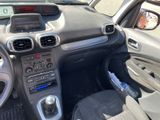 the interior of a small car with dashboard controls and dashboard lights