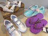 several pairs of shoes that are sitting on a table