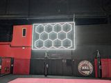 the inside of a gym with a pink floor and red walls