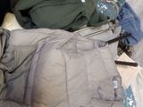 a suitcase full of clothes and other items on the floor