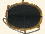 a black and gold purse with a chain around it