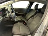 the interior of a car with a steering wheel and a dashboard