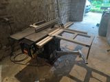 an image of a table sawing machine in a garage