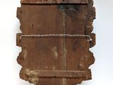 a wooden shelf that has a wooden plaque on it