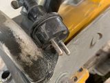 a close up of a motorcycle with a chain attached to it