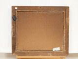 an old wooden easel with a piece of cardboard on top of it