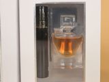 an image of a bottle of perfume and a bottle of perfume in a box