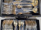 a box with silverware in it on a table