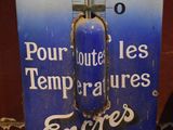 a blue and white thermometer on display in a room