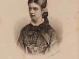 portrait of a woman in a lace collared dress with a flower in her hair