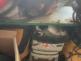 a picture of a pile of assorted items under a table