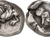 a close up of a coin with a horse and a man on it
