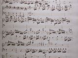 an old sheet of music with musical notations on it