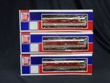 three red and blue train cars are stacked on top of each other