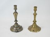 pair of antique brass candlesticks on a white background