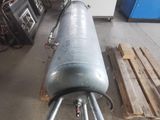 an image of a large metal pipe in a warehouse
