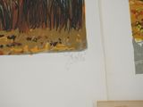 two paintings hanging on the wall of a room