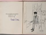 a book with a drawing of a man sitting on a bench