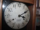 a clock that is hanging on the wall in the room